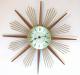 Snider starburst clock with wood and wire rays