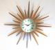 Snider starburst clock with multi-length rays