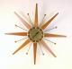 Snider starburst clock with flat wood and brass-plated metal rod rays (mid/late 1960s, electric)