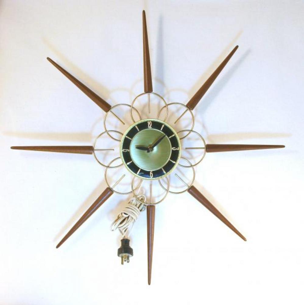 Snider starburst wall clock with brass-plated metal rods and long walnut cone rays, less common BLACK ring on dial (early/mid 1960s, electric) 