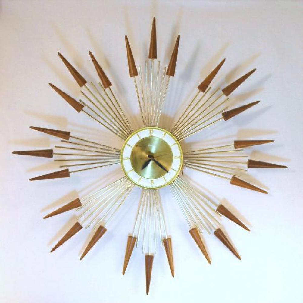 Snider large starburst wall clock with eight groups of three short walnut cones on brass-plated metal rods (early/mid 1960s, electric)