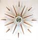 Snider large starburst wall clock with brass-plated metal rods and short and long walnut wood rays (early/mid 1960s, electric)