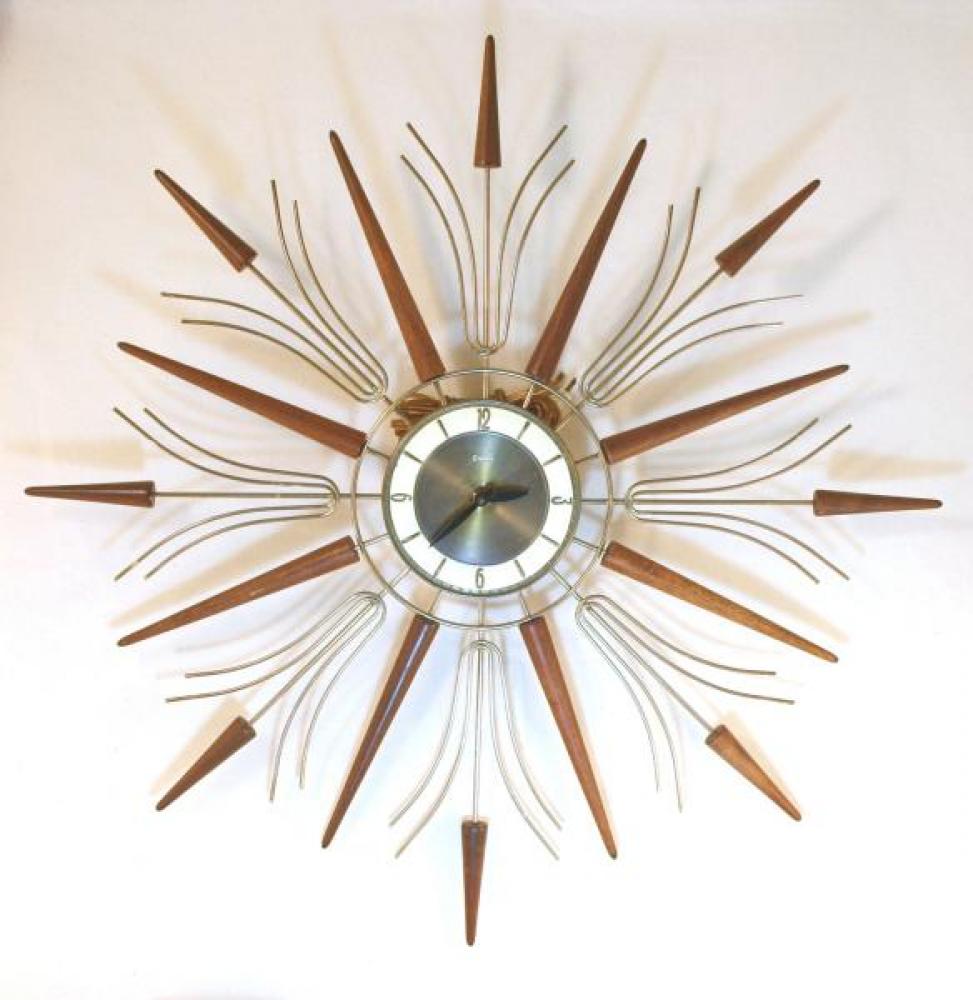 Snider large starburst wall clock with brass-plated metal rods and short and long walnut wood rays (early/mid 1960s, electric)