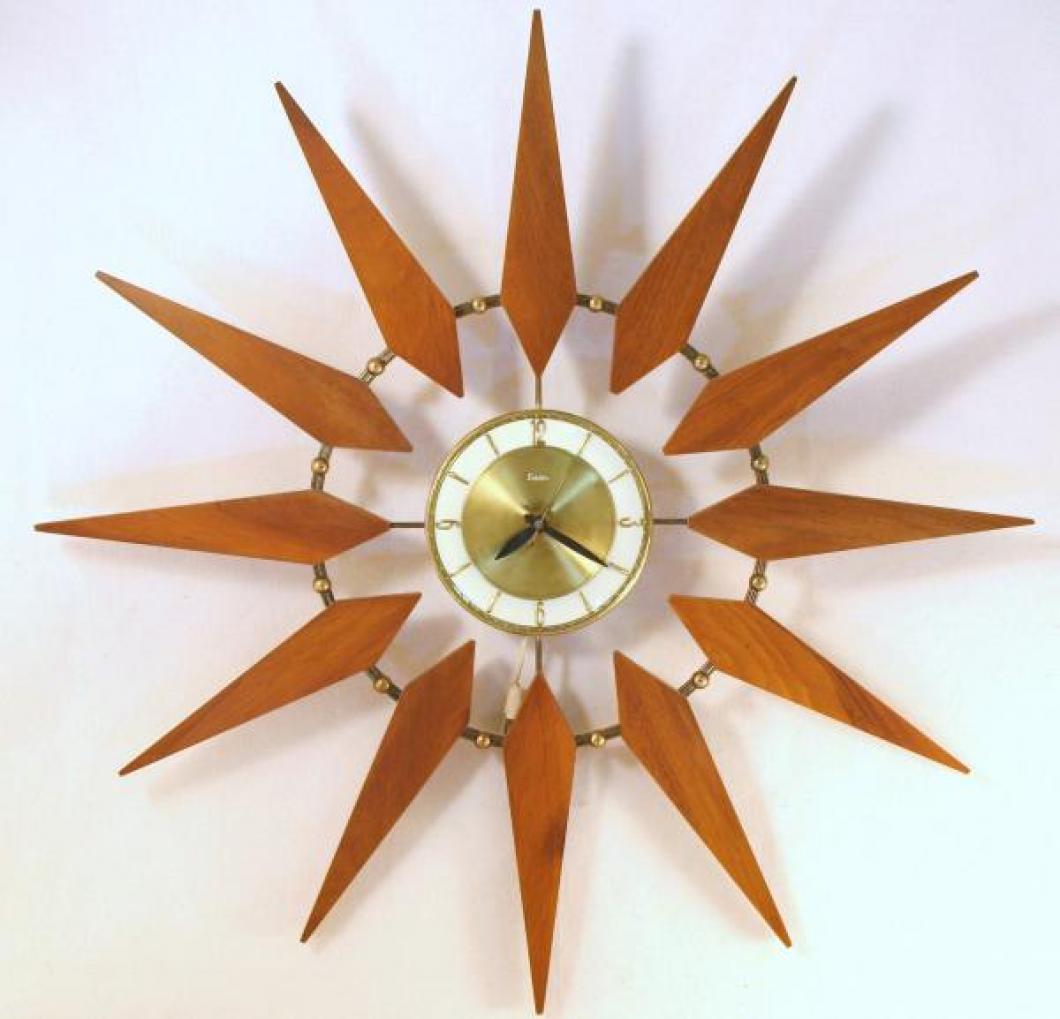 Snider starburst wall clock with brass-plated metal rod ring and balls,  and tie-shaped walnut rays attached from behind (early/mid 1960s, electric)