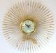 Snider starburst wall clock with many brass-plated metal rod rays, glass cover over dial (late 1950s, electric, probably never had wood rays)
