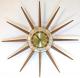 Snider starburst wall clock with 12 long walnut cone rays (1960s, simple design, electric)