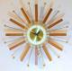 Snider starburst wall clock with brass-plated rods and teak wood rays rays (1960s, electric)
