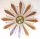 Snider starburst clock with brass-plated rods and tie-shaped teak(?) rays (1960s, electric)