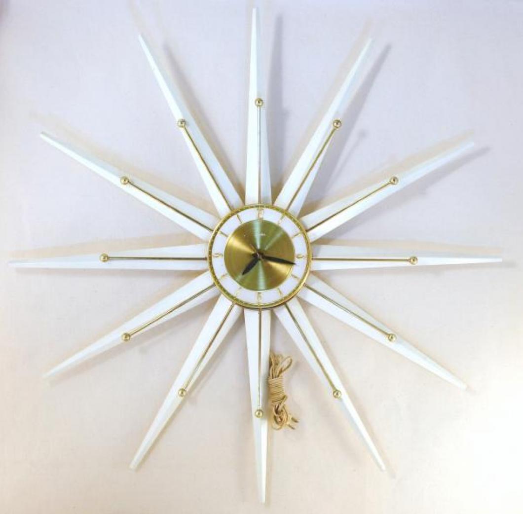 Snider starburst wall clock with brass-plated rods and white-painted metal rays (mid 1960s, electric, "French Provincial" series)