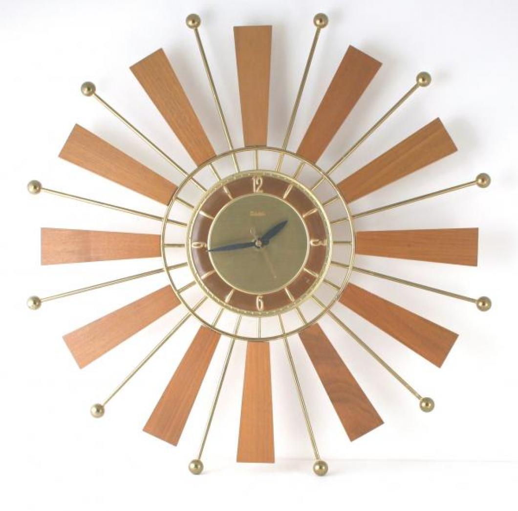 Snider starburst wall clock with brass-plated rods and teak wood rays (mid 1960s, electric)