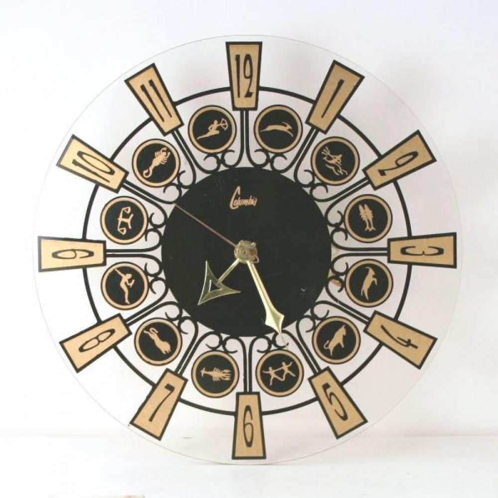 Snider "zodiac" symbols wall clock (late 1960s, electric, has their Columbia "no name" brand label on the clear Plexiglas dial but the Snider label on the back)