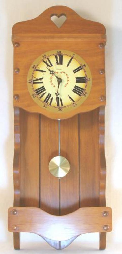 Snider wooden wall clock with pendulum (early 1970s, battery operated, Michael Snider design)