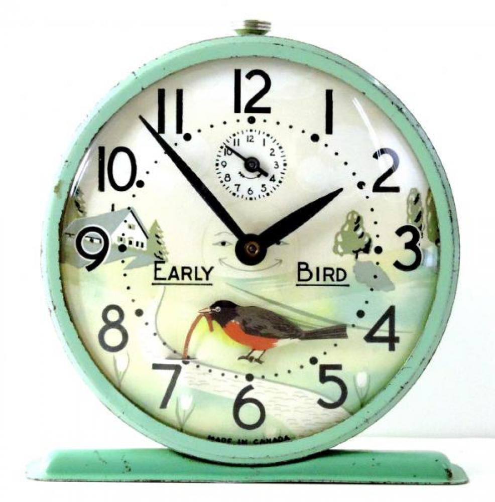 Westclox "Early Bird" model animated alarm clock with green case (windup, bobbing robin pulling worm, late 1940s to 1950s)