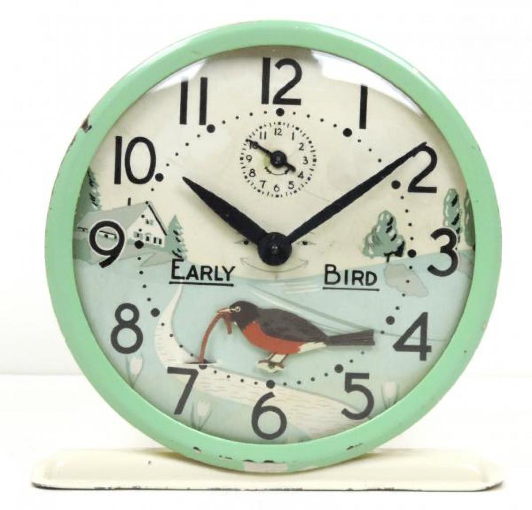 Westclox "Early Bird" model animated alarm clock with green and cream coloured case (windup, late 1940s to 1950s)