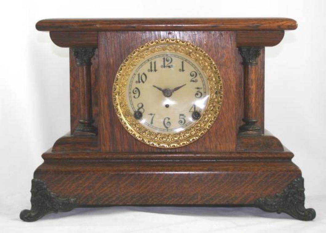 Pequegnat "Berlin" model mantel clock - dark feet and gold framed face