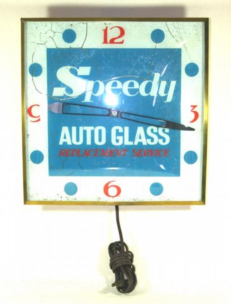 Advertising clock made by the Canadian Neon-Ray Clock Co., Montreal, QC, advertising Speedy Auto Glass Replacement Services