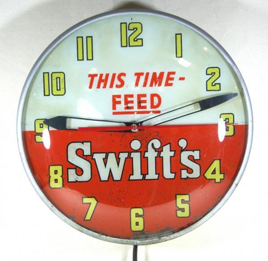 Advertising clock made by the Canadian Neon-Ray Clock Co., Montreal, QC, advertising Swift's Feed