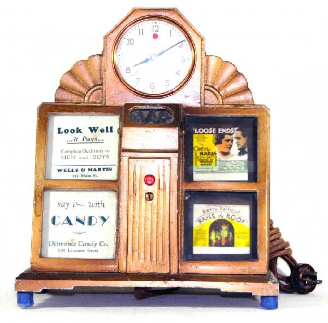 Advertising clock made by General Electric, with spaces for several local businesses or services to place an advertisement