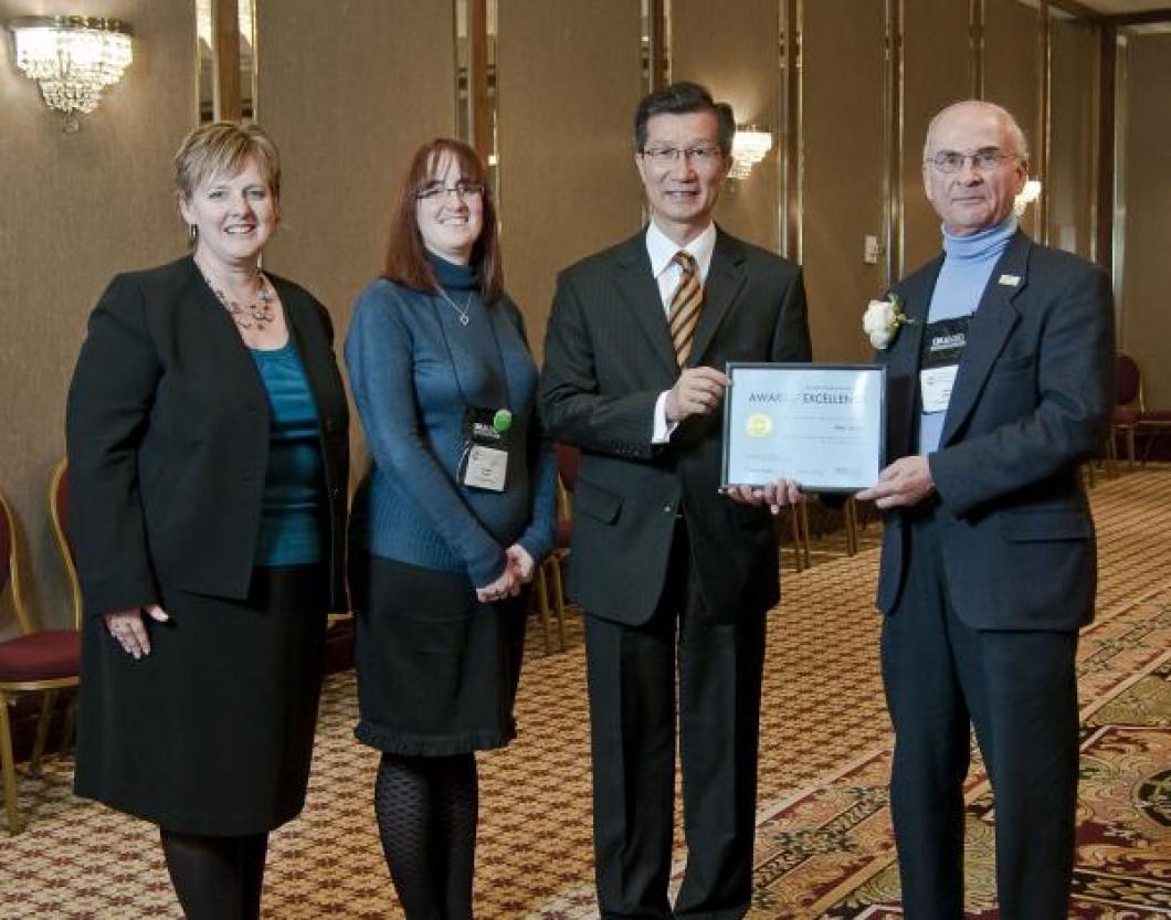 Photo credit Graham Iddon for the Ontario Museum Association.  From the left:  Tammy Adkin (Chair of the 2010 OMA Awards Committee), Kathleen Powell (President of the OMA), Minister Michael Chan, and Allan.