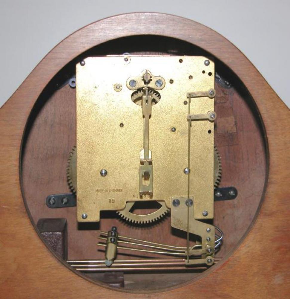 A typical time & strike movement in postwar mantel clocks (tuned rods).