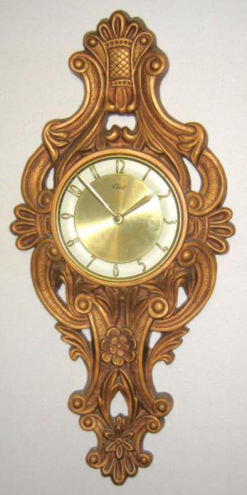 Molded polymer foam case, BARBOQUE model battery wall clock, 24" H (in 1971 catalogue) dated 1974 (donated to museum April 2014 by Girotti family)