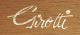 The script word Girotti on wood panel clock dials
