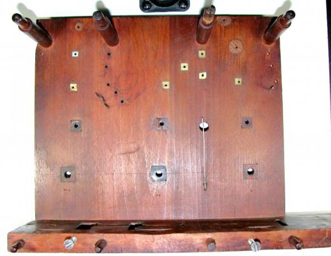 The INSIDE of the wood BACK plate; note the square lignum vitae bushings and the many INSET bone and wood bushings.