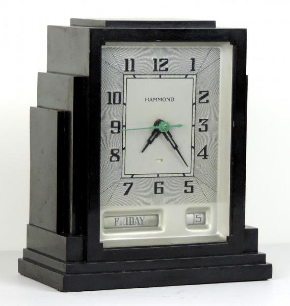 Silver dial GREGORY model mantel clock.