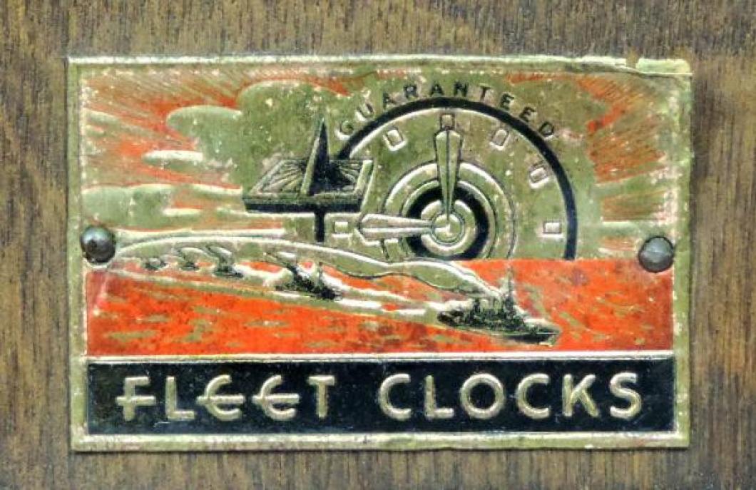 FLEET mantel clock with metal foil label on back THE LABEL (1" high by 1 3/4" wide)