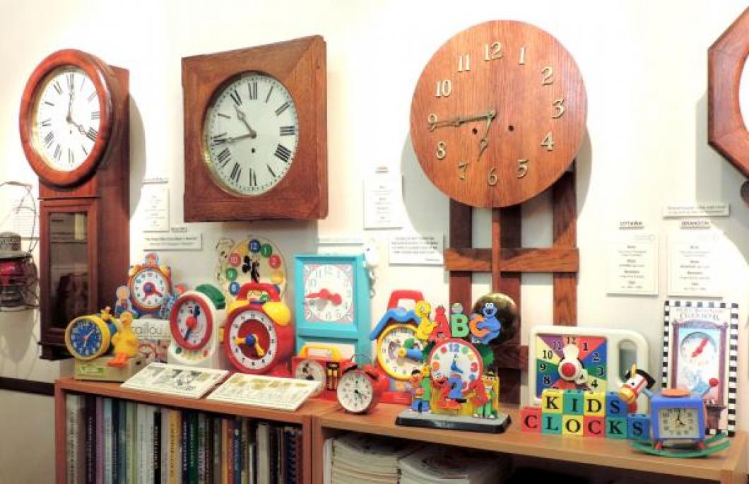 More kids' clocks in the reference library (Pequegnat Regulator No. 1, York, and Ottawa on the wall).