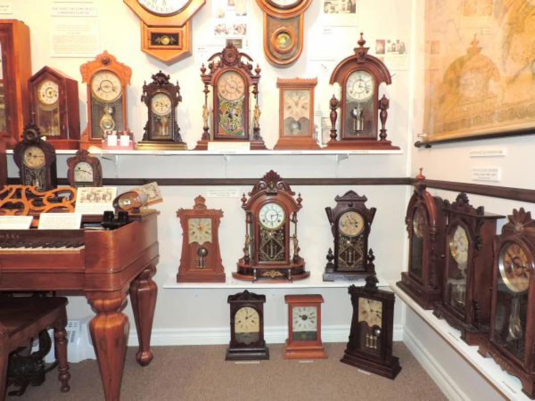 A wider view of many Canada Clock Company (Hamilton) mantel clocks early 1880s