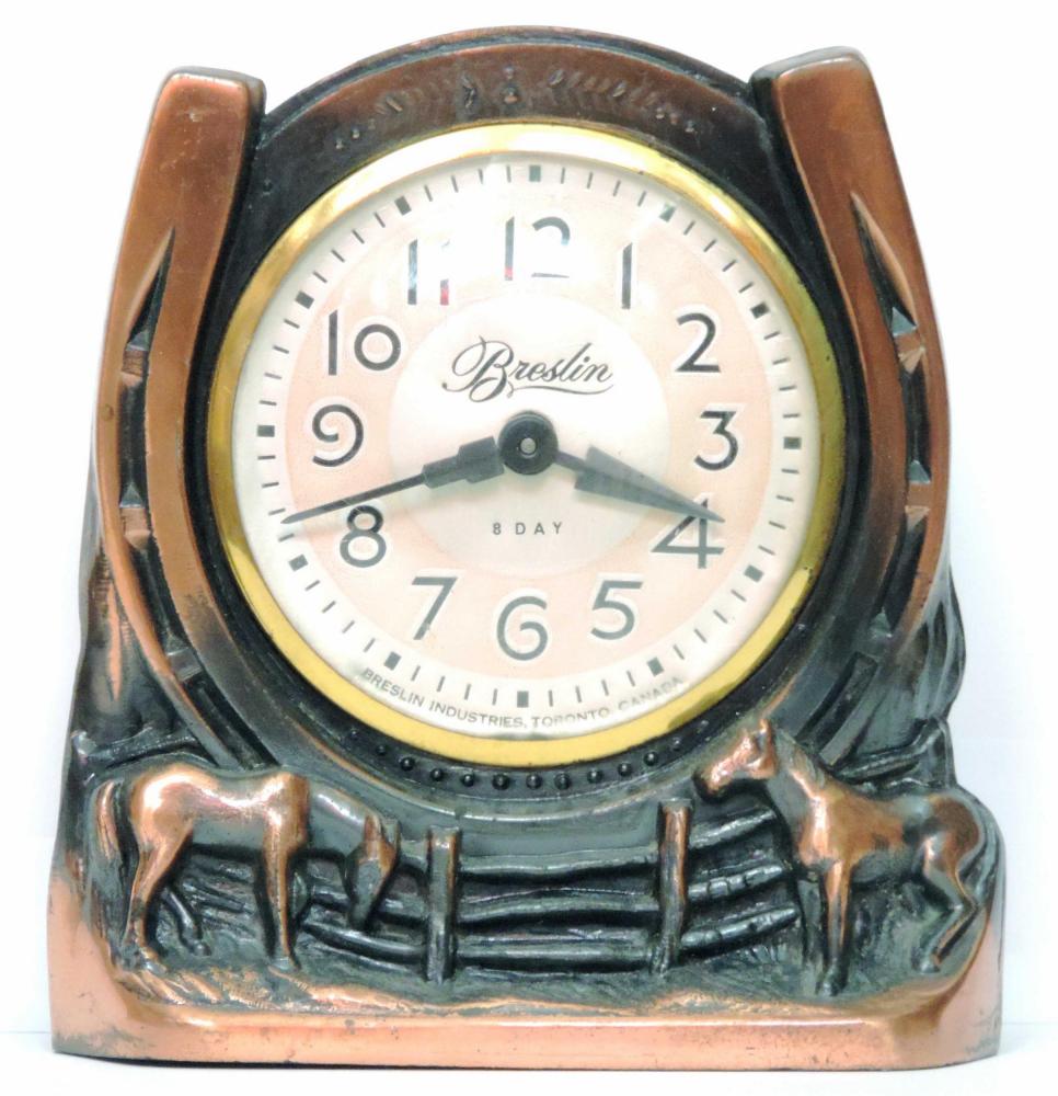 windup clock in metal horseshoe (probably removed from the base af a horse horseshoe clock)