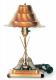 Breslin electric LAMP with copper-coloured metal shade and base, curling stone and two brooms