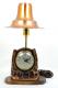 Breslin copper-coloured electric lamp with windup clock