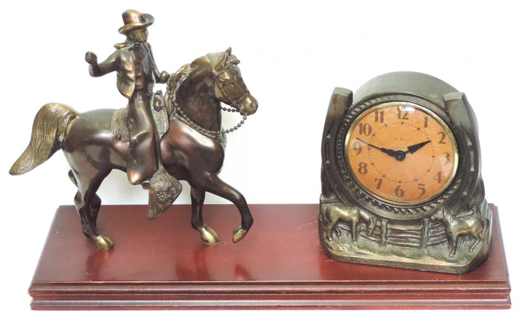 Probably Breslin cowboy on horse with windup clock in metal horseshoe